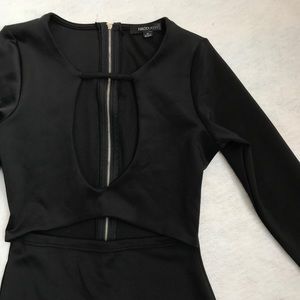 Body hugging black dress with cutouts